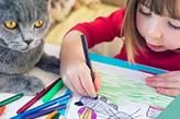 cat keeping children occupied